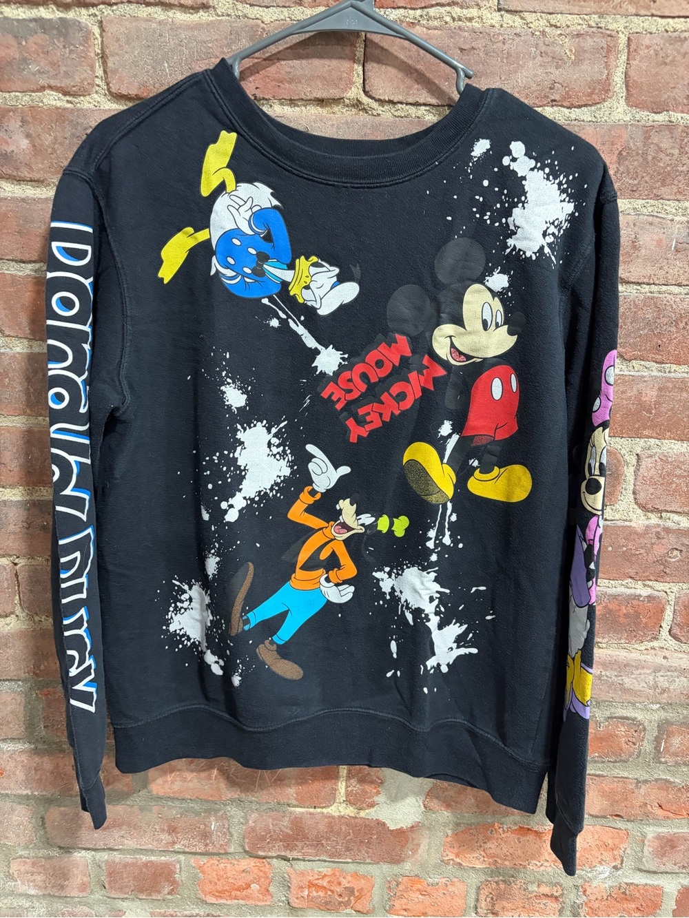 Disney Mickey & Friends Graphic Sweatshirt with Colorful Prints and white splat